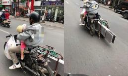 Hình ảnh ông bố chở đồ cồng kềnh trên phố, một tay ôm con trước ngực khiến ai nhìn cũng thương