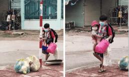 Cha mẹ F0 đều đã đi cách ly, bé trai cắp nách em nhỏ đi vào khu điều trị, khiến ai cũng thương