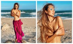 Hà Anh dùng tay che vòng một thả rông, quyến rũ hết nấc trên bãi biển