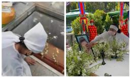 Vợ nghệ sĩ Thanh Tú nghẹn ngào quỳ bên mộ, vuốt di ảnh chồng lần cuối