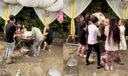 Gái xinh váy ngắn nằm giữa bàn để nhóm nam nữ công kênh, nhún nhảy ở đám cưới gây tranh cãi