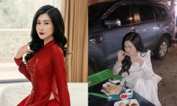 Vừa xong đám hỏi, vợ cầu thủ Huy Hùng 'xả vai' ngồi lề đường ăn vội