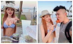 Ngân 98 gây sốc khi diện bikini bé tẹo đứng bán cá viên chiên vỉa hè