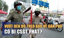 Vượt đèn đỏ theo chỉ dẫn của bảo vệ dân phố có bị CSGT phạt không?