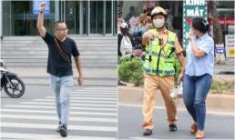 Có bắt buộc đi bộ sang đường phải vẫy tay báo hiệu trong mọi trường hợp?