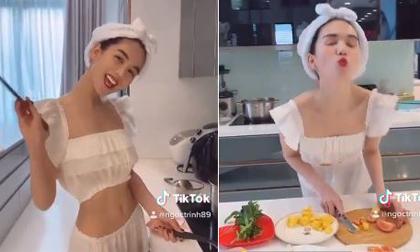Ngọc Trinh khoe dáng mỏng tang lúc nấu ăn, phản pháo khi bị chê ngoại hình