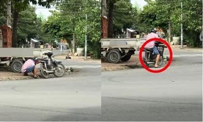 Cũng lúi húi móc cống thoát nước, nhưng hành động của người đàn ông khiến ai nấy đều bất bình