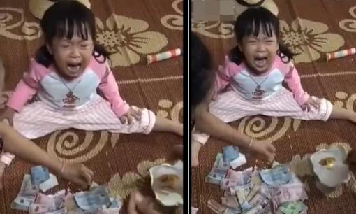 Bố đập lợn đất lấy tiền ủng hộ miền Trung, bé gái gào khóc vì lý do cực đáng yêu này!