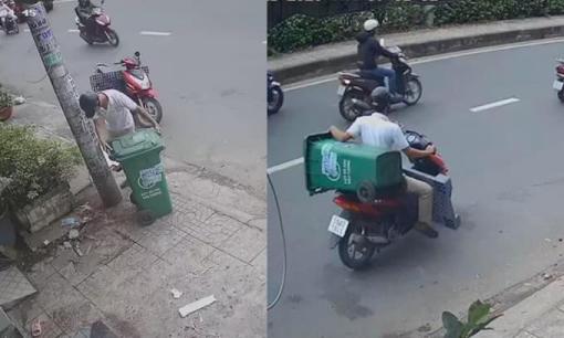 Người đàn ông thản nhiên trộm thùng rác giữa chốn đông người gây bức xúc