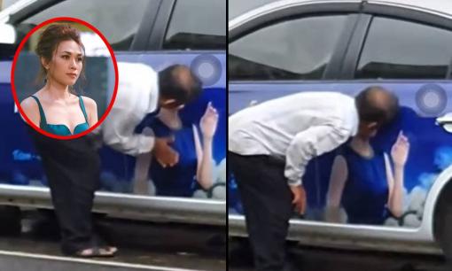 Cư dân mạng bức xúc trước clip người đàn ông làm hành động nhạy cảm lên ảnh quảng cáo của Mỹ Tâm