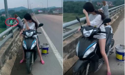 Mặc người qua đường nhắc nhở, 2 chân dài thản nhiên đổ hết rác xuống sông gây bức xúc