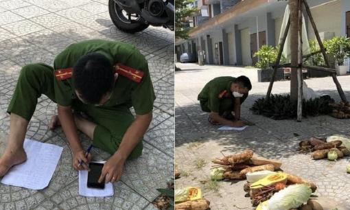 Chiến sĩ công an ngồi bệt dưới đất giữa trưa nắng để tính toán tỉ mẩn phần lương thực khiến chị em thán phục