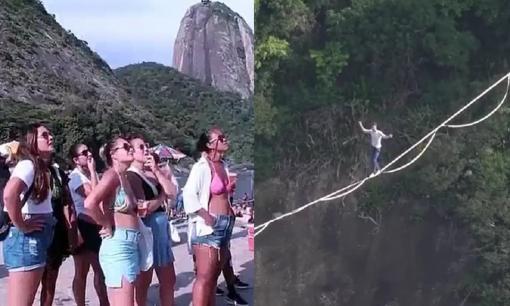 Du khách nín thở xem 'kẻ liều mạng' đi trên dây giữa 2 đỉnh núi cao chót vót
