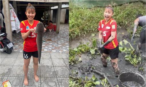 Hình ảnh nhà vô địch SEA Games 31 - Chương Thị Kiều lội bùn, bắt cá ở quê gây sốt dân mạng