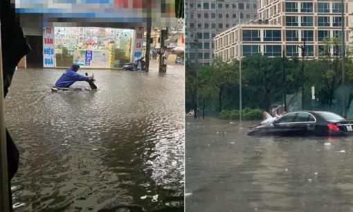 Dân mạng đăng loạt ảnh bì bõm lội nước giữa cơn mưa lớn chiều nay: 'Hà Nội mùa này phố cũng như sông' 
