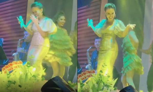 Cẩm Ly lắc đầu, cười trừ trên sân khấu khi định ra nhảy cùng vũ đoàn nhưng lại quên bài