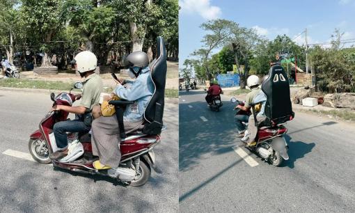 Chạy xe máy về quê đón Tết, ông chồng 'chế' ghế tựa lưng cực độc cho vợ đỡ mỏi