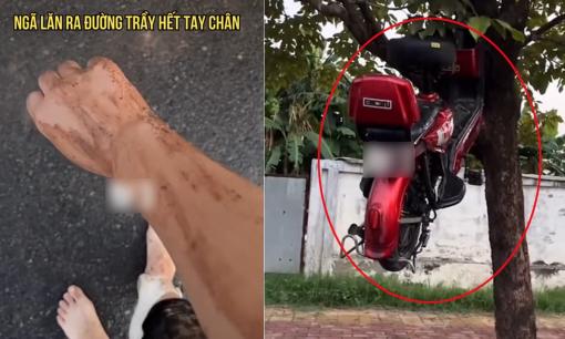 Đi xe vội vàng, chàng trai bị ngã xây xước chân tay nhưng điều chú ý là chiếc xe máy vắt trên cây