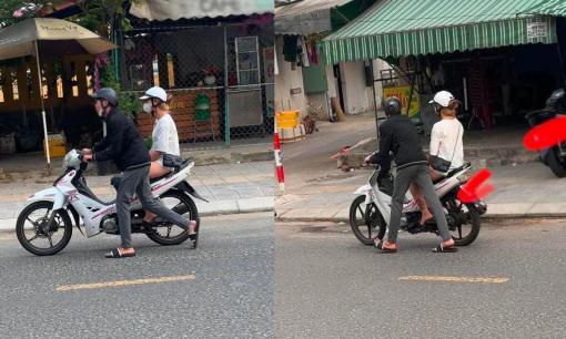 Mặc trời nắng nóng, cô gái vẫn thản nhiên ngồi trên xe máy để mặc bạn trai đẩy, cư dân mạng ngán ngẩm