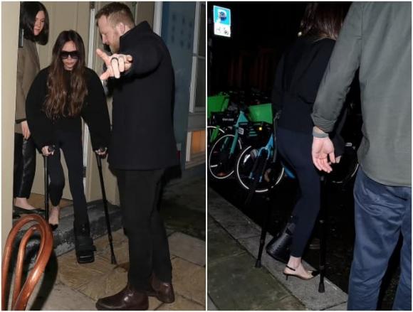 View - Victoria Beckham không để việc gãy chân ảnh hưởng đến phong cách khi cô đi loạng choạng trên đôi giày cao gót và nạng hơn 28 triệu đồng 